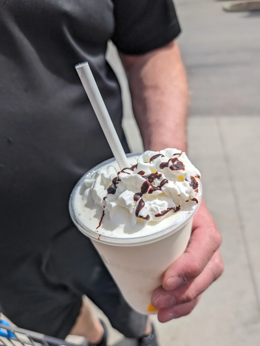 Vanilla Chai Late with Whipped Cream and Chocolate Drizzle