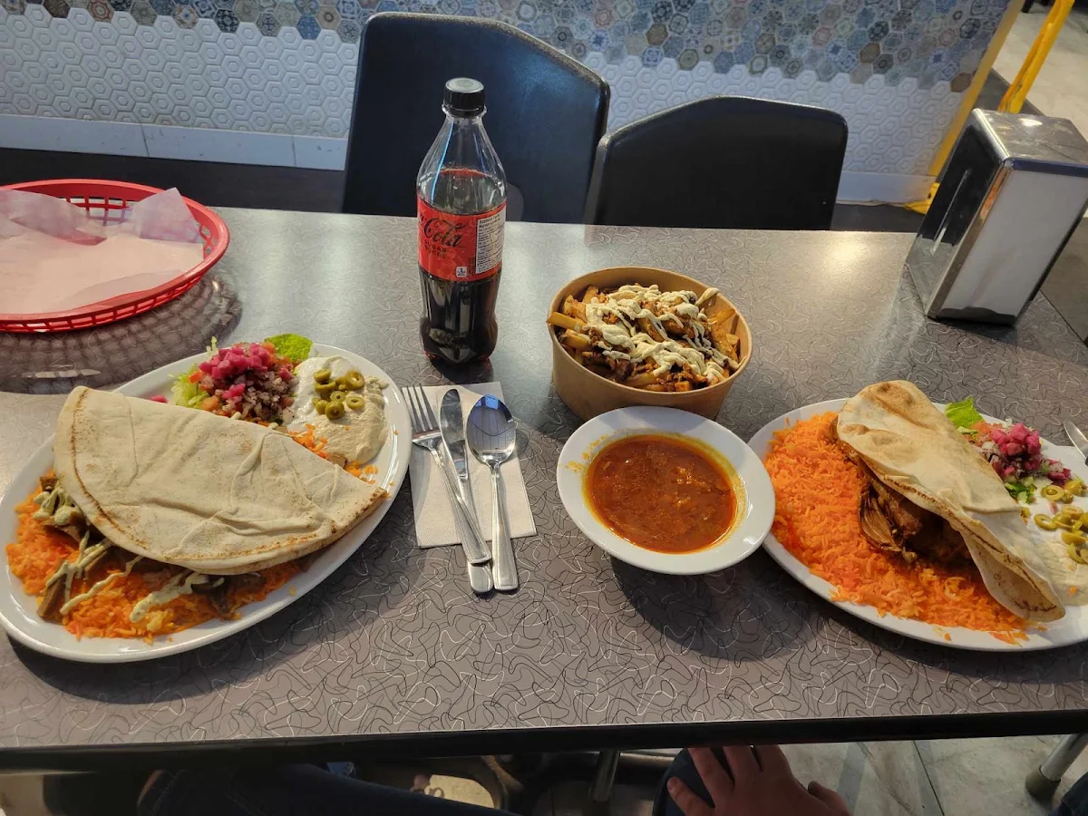 Lamb Shank Right Donair Platter Left Chicken Shawarma Poutine Up Top
