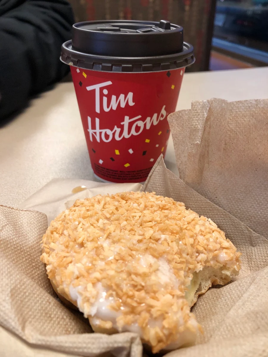 Coconut Cream Filled Donut and Coffee