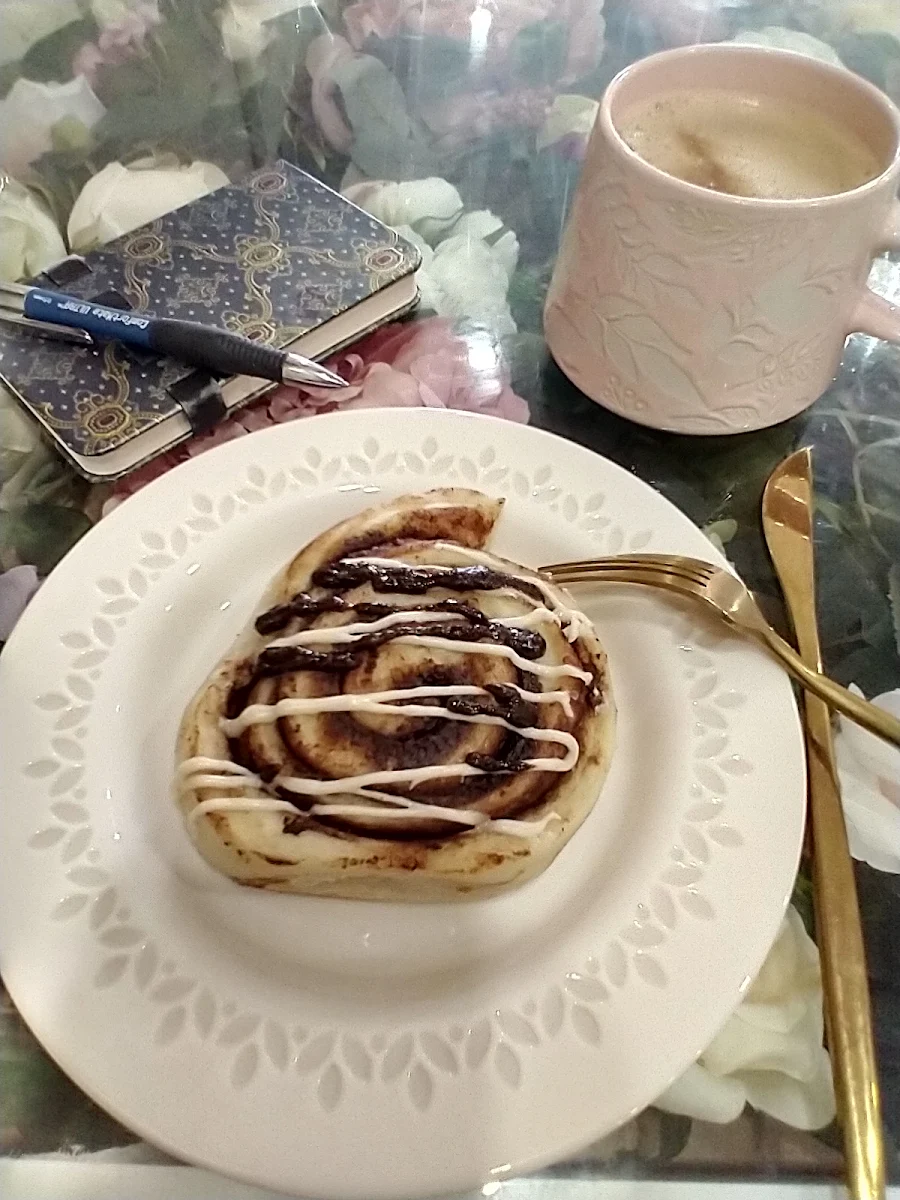Cinnamon Bun and a Cafe Latte with Oat Milk