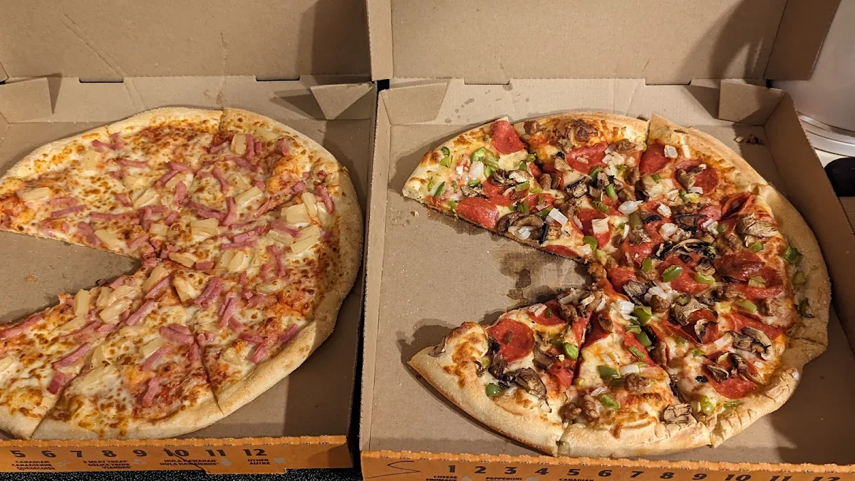 Left Hawaiian Pizza Right Ultimate Supreme Pizza