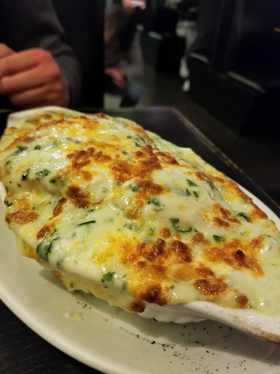 Baked Bass Fillet & Spinach on Rice in Cream Sauce