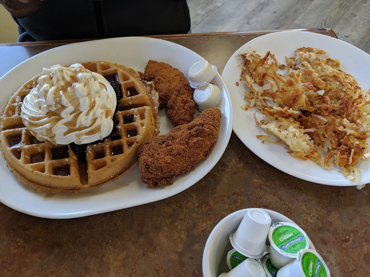 Chicken and Waffles with Blueberry Toppings Well Done Hash Browns