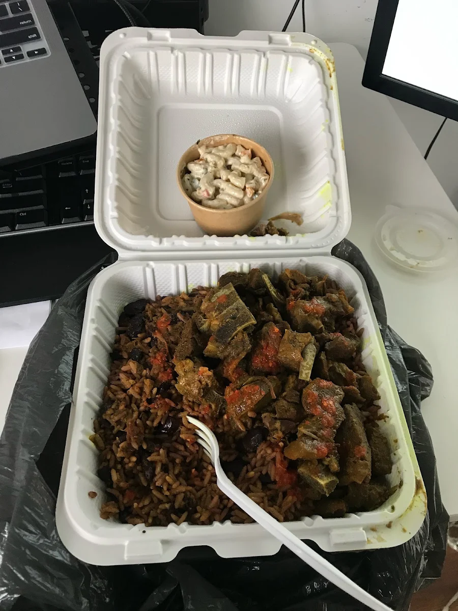 Curry Goat with Hot Sauce with Rice and Peas and Macaroni Salad