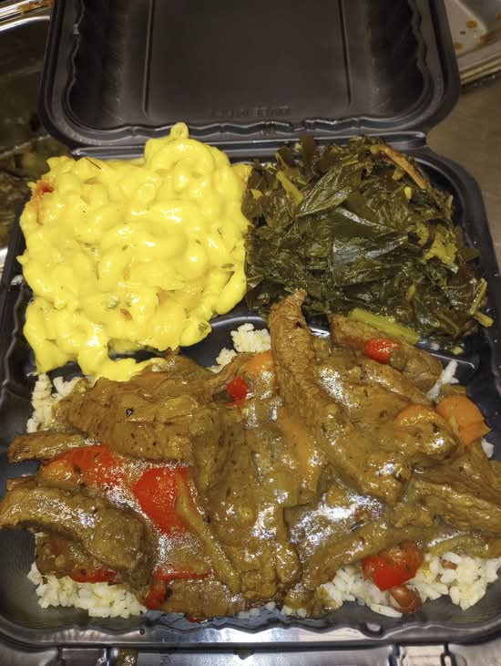 Curry Goat over Rice with 2 sides