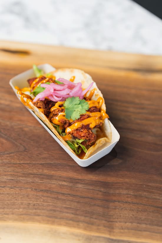2 Tandoori Fried Chicken Roti-Tacos Served With Masala Fries