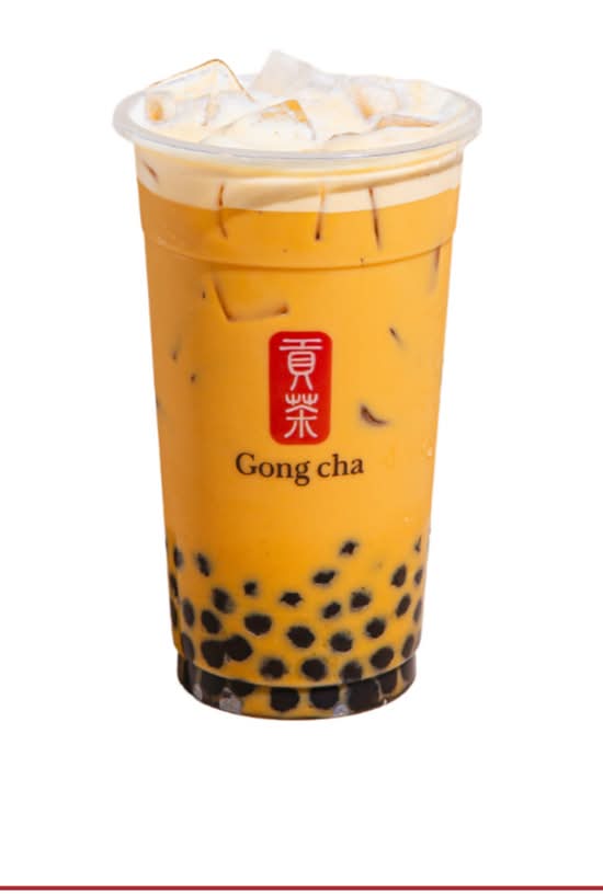 Pumpkin spice milk tea with pearls and milk foam