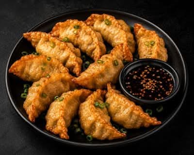 Fried Dumplings accompanied with Essence Sauce 🥫
