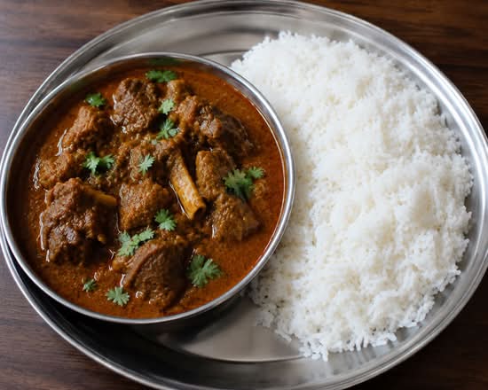 Goat curry with plain rice
