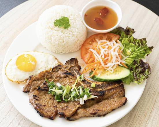 Grilled Pork Chop and Fried Egg with Steamed Rice (Com suon nuong, op la)