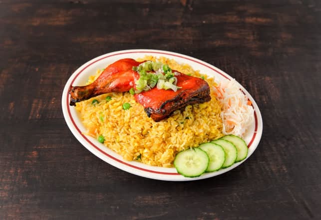 57. Fried chicken Leg on fried rice