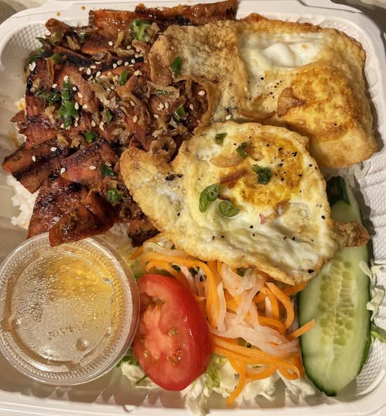 Two sunny-side-up and grilled pork slices with Rice