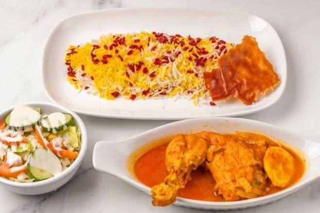 Zereshk Polo/Chicken with tomato sauce and rice with berry