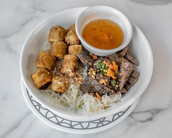 56. Grilled Beef with Two Spring Rolls on Vermicelli Noodles