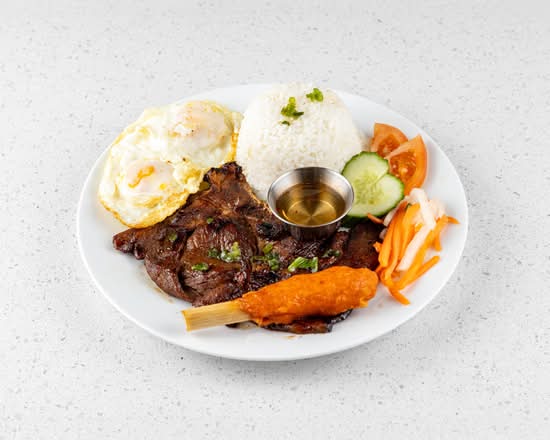 57. Pork Chop, 2 Eggs, and Sugar Cane Shrimp on Rice