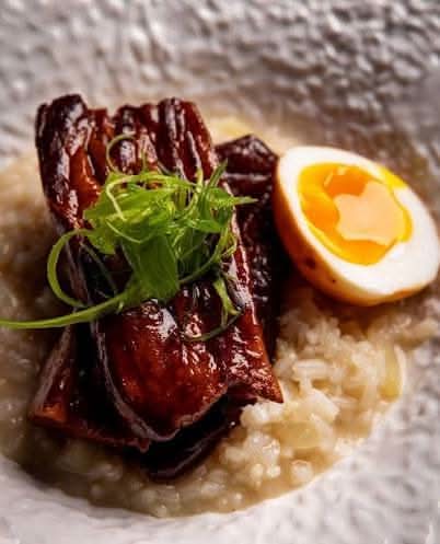Oat congee with pork belly / Cháo yến mạch, heo ba chỉ kho, hành khô, dầu hành, ngò, giá, trứng xì dầu, hạt tiêu