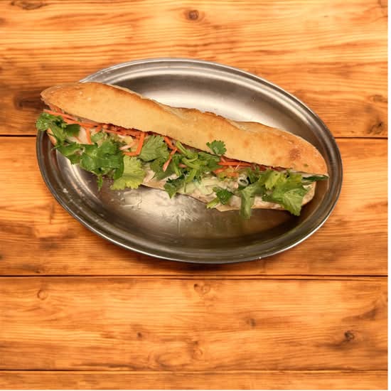 Baguette with tunna, mayo, cilantro, onions , cucumber, pickled vegetables