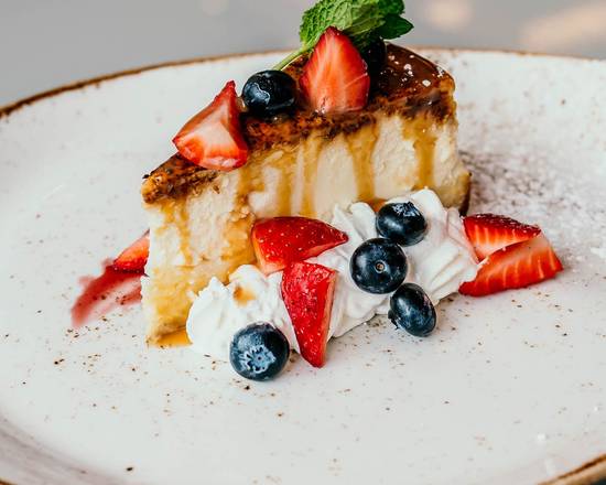 Crème Brulee Cheesecake with Berry Compote