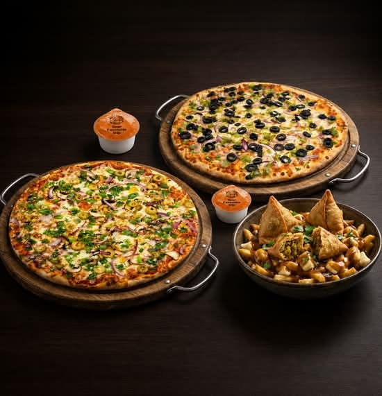 Family Feast - 2 Pizzas, 4 toppings each, 2 dips, and samosa poutine or any chaap