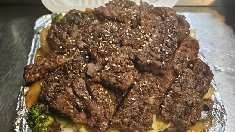 KBT Signature 8 Oz. Rib Eye Steak Rice Bowl with Miso and assorted side dishes