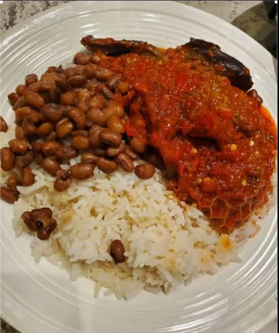White rice and beans with Palm oil stew