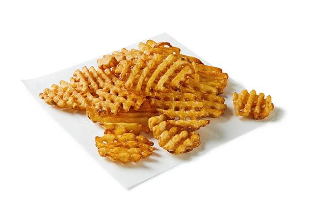 Nouvelles frites gaufrées dorées et croustillantes