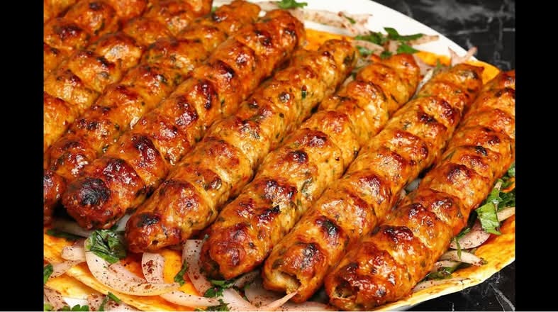 5 skewers spicy chicken kebab  on charcoal