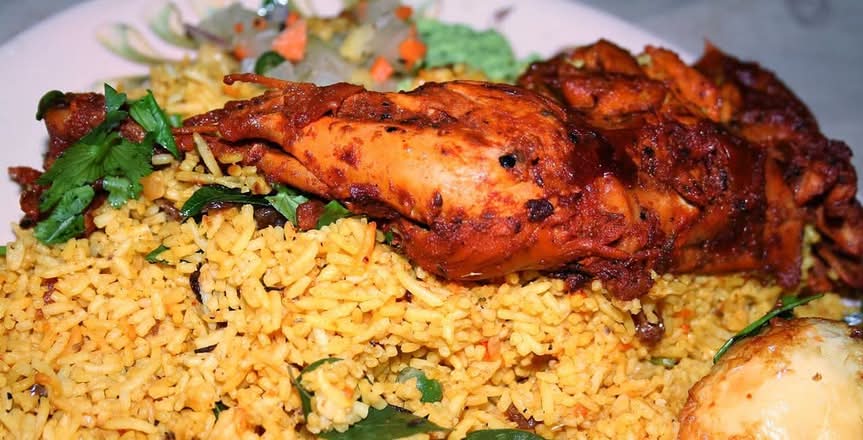 AL FAHAM Biriyani (MEAL for 1 - 32 OZ Packing - Quarter chicken AL FAHAM) - on Jeerakasala Biriyani. Served with Salad, Achar & Pappadam