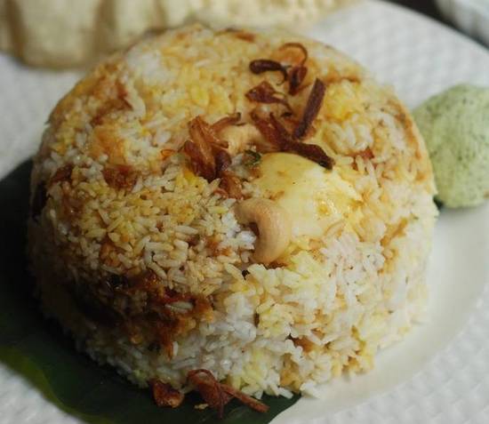 EGG Biriyani (MEAL for 1 - 32 OZ Packing - 2 EGGS) – Made in Jeerakasala rice garnished with Ghee roasted cashew and Raisin– Served with Salad, Achar & Pappadam