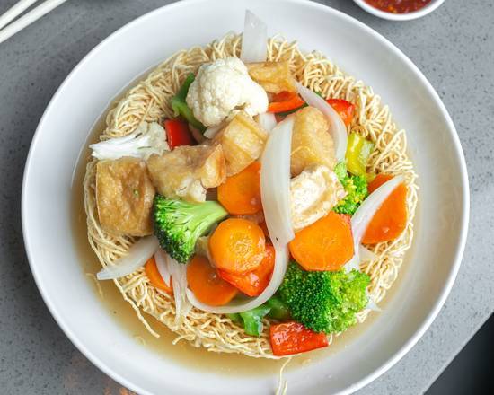 V35. (NOT VEGAN) Stir-Fried Vegetables & Tofu on Crispy Egg Noodles Nest