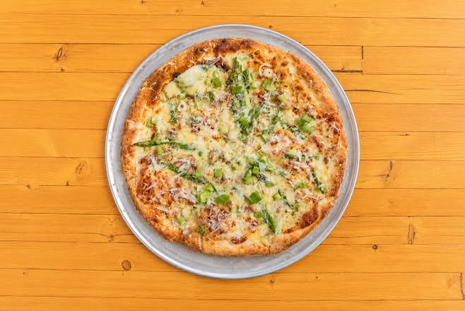 community love feature pizza: asparagus carbonara pizza
