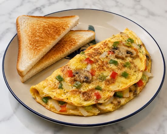 Omelette with peper mushooms, onion and toast.