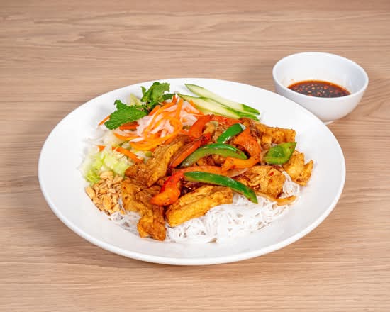 Grilled Lemongrass Tofu with Satay Sauce, Vermicelli noodles, Fresh Herbs, and House Dipping Sauce.