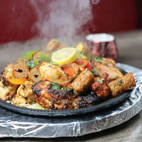 Mix Grill (2pc Chicken Seekh Kebab, 2pc lamb seekh kebab,5 Boneless Chicken, 2 Naan with Channa, Salad, Chutney)