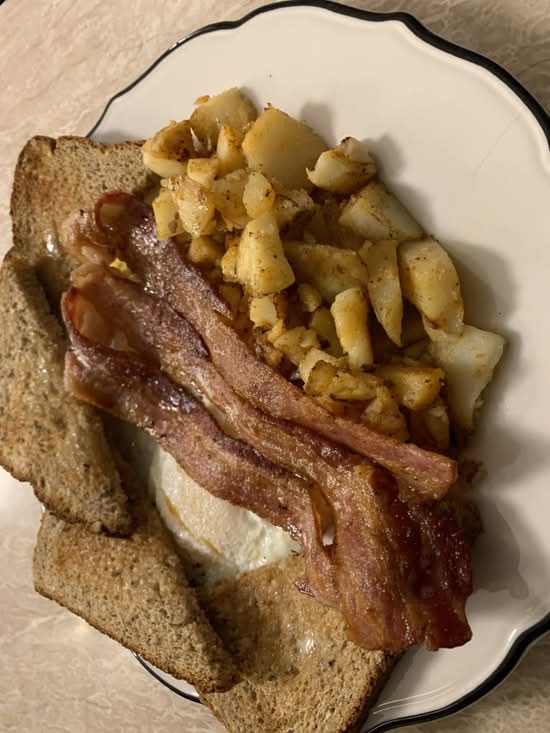 Classic Breakfast with 2 large eggs,  bacon, ham, or sausage, homefries and toast