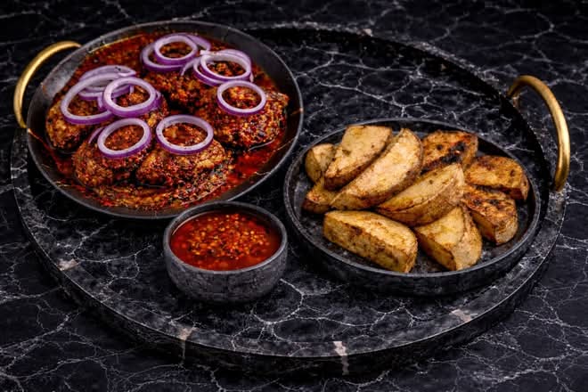 Roasted Sweet potato with sauced smoked fish and sauced ponmo