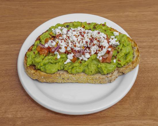 Avocado Toast Topped with Diced Tomatoes, Onion and Feta